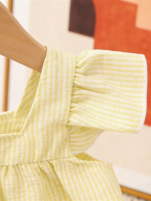 Yellow gingham baby top with ruffled sleeves and straps