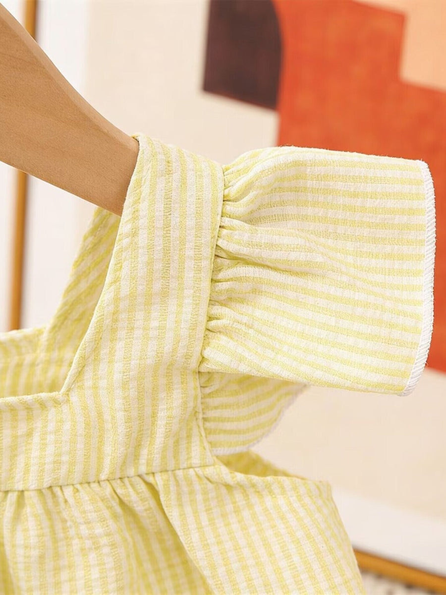 Yellow gingham baby top with ruffled sleeves and straps