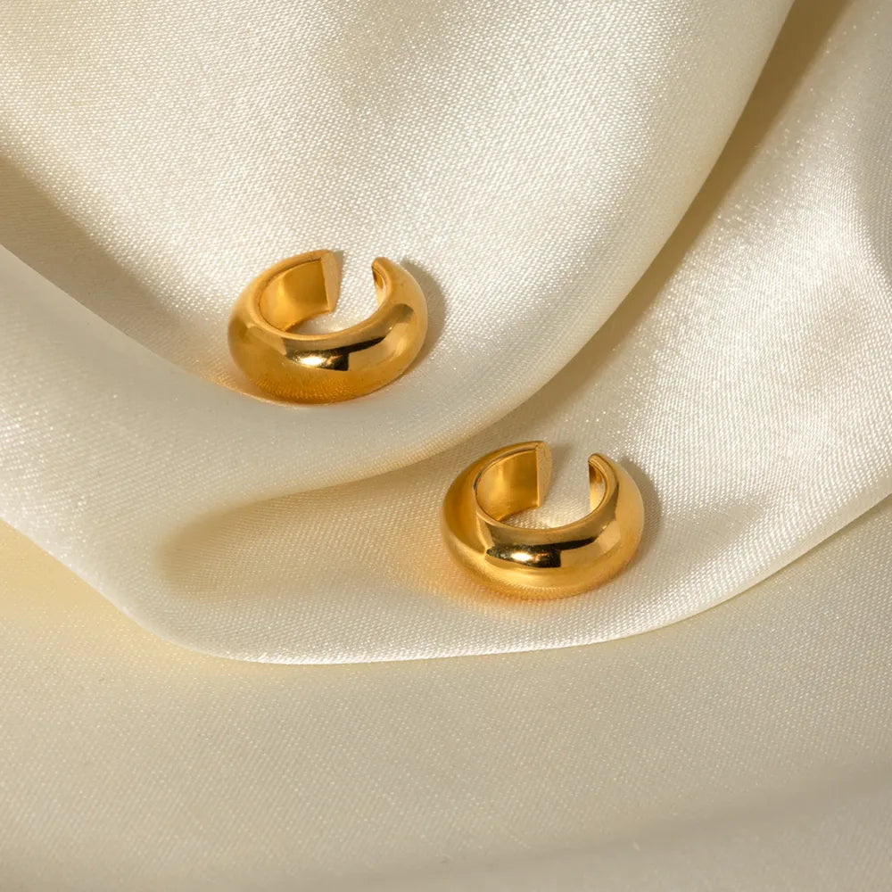 Gold-tone sculptural ear cuff duo with a contemporary design.