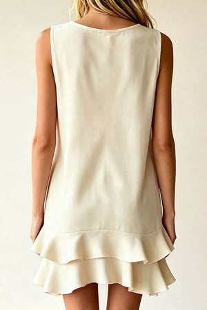 Beige polyester mini dress with V-neck, sleeveless, and double ruffle hem.