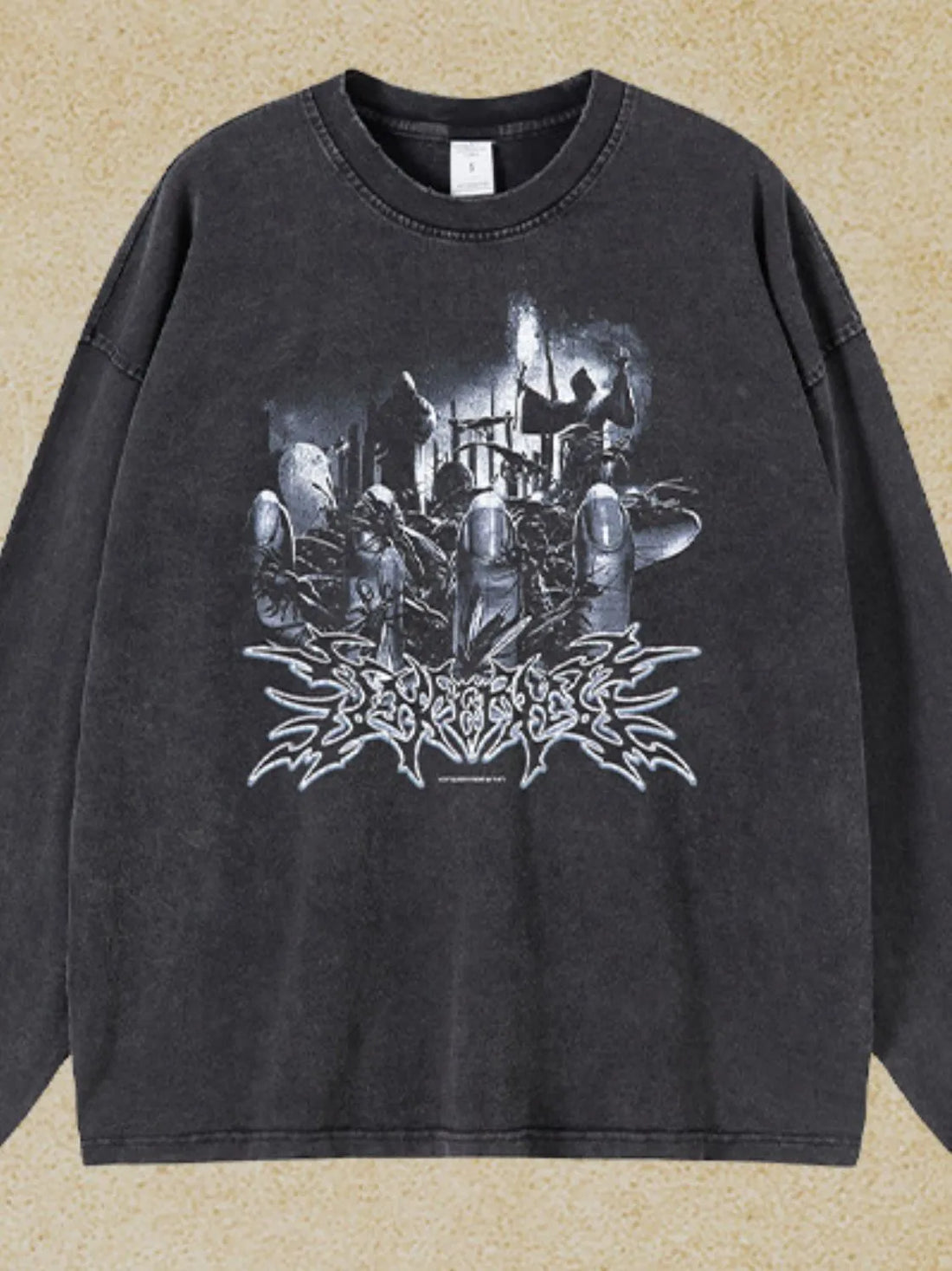 Washed black oversized long sleeve t-shirt with a graphic print and distressed details.
