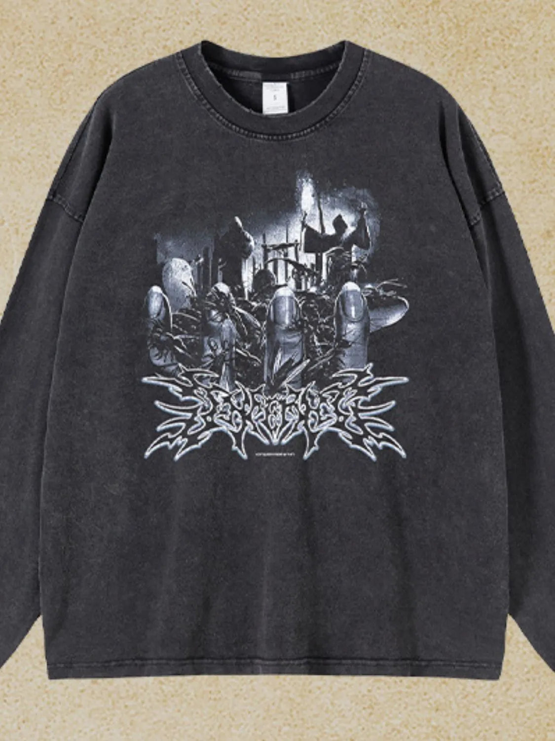 Washed black oversized long sleeve t-shirt with a graphic print and distressed details.