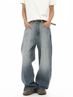 Men's relaxed-fit jeans in blue plaid denim with a buttoned front and belt.