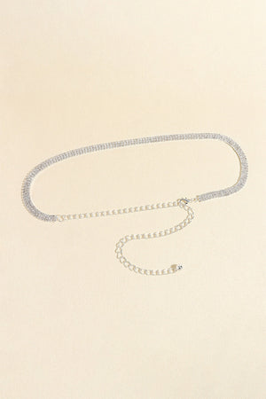 Triple-row crystal waist chain in silver with adjustable clasp and extender chain.