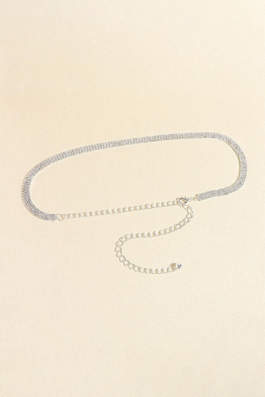 Triple-row crystal waist chain in silver with adjustable clasp and extender chain.