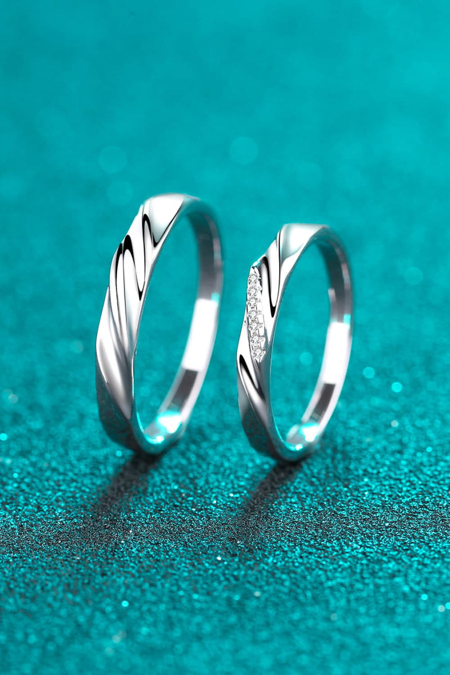 Twisted embrace silver ring set, 925 sterling silver, one with small diamonds.