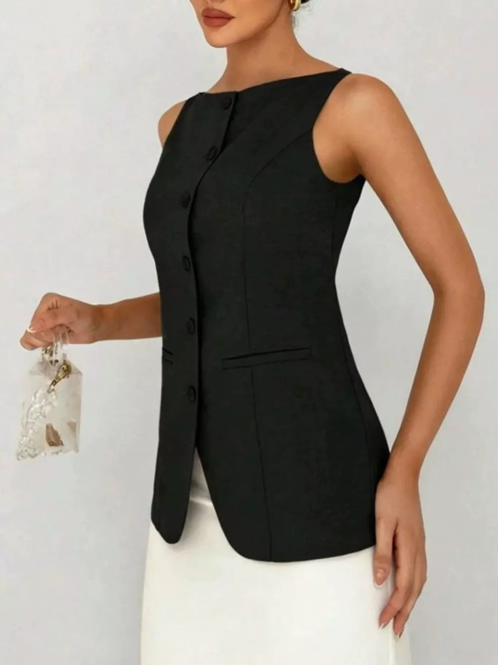 Black sleeveless button-down vest with boat neckline and pocket detail