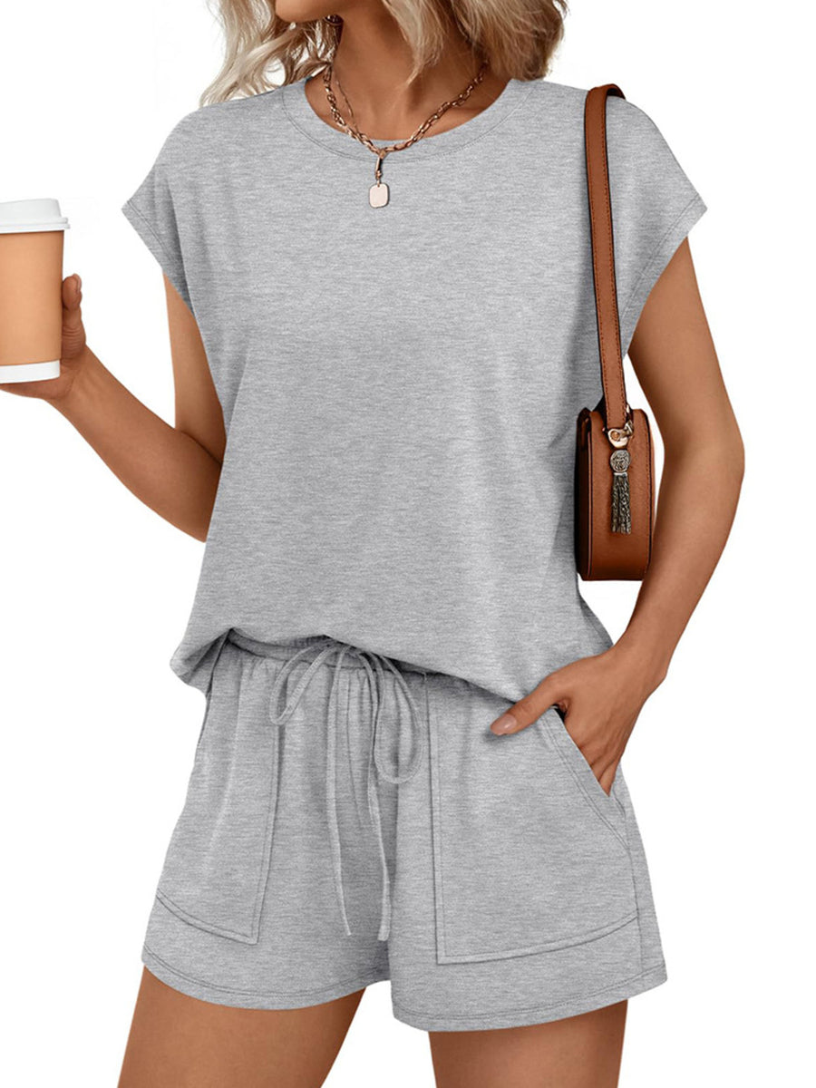 Light gray round neck cap sleeve loungewear set with drawstring shorts and pockets.