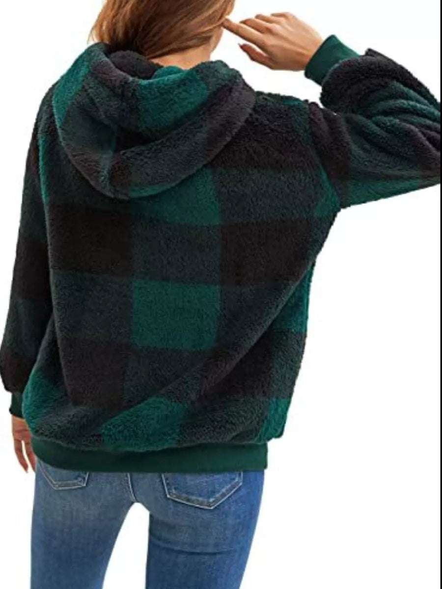 Green and black plaid sherpa drawstring hoodie with a cozy fleece texture.