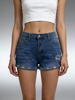 Dark blue denim shorts with distressed details and rolled cuffs