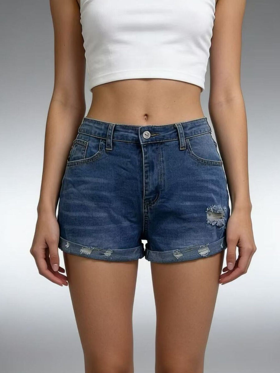 Dark blue denim shorts with distressed details and rolled cuffs