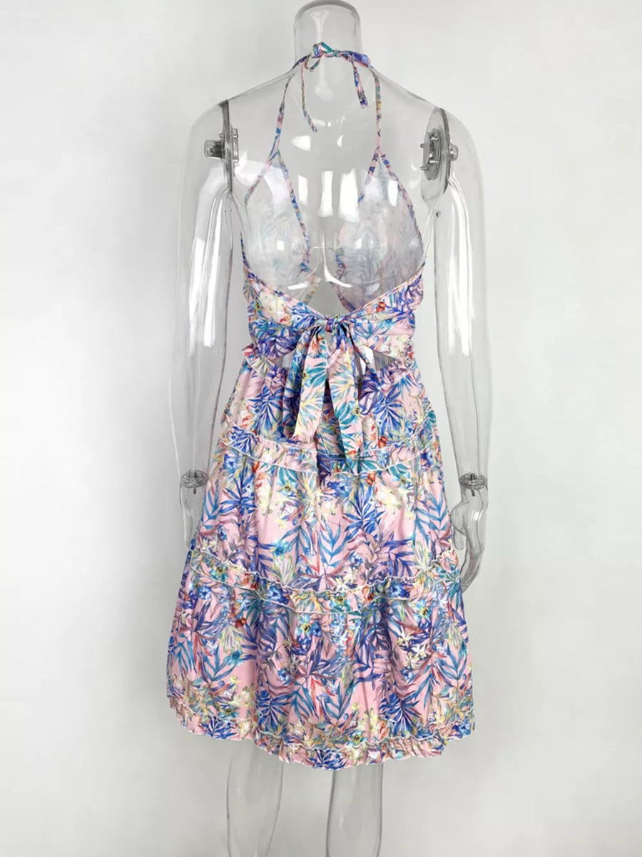 Abstract print halter mini dress with cutout back and tie detail in pink floral.