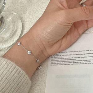 Silver delicate four-leaf clover charm bracelet with crystal accents