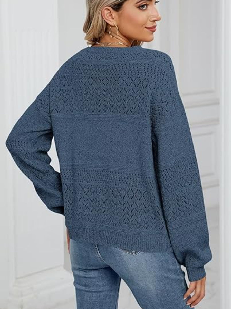 Peacock Blue knit sweater with diamond eyelet detail and V-neck.