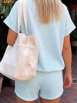 Light blue and white striped t-shirt and shorts set with cuffed sleeves and a canvas tote bag.
