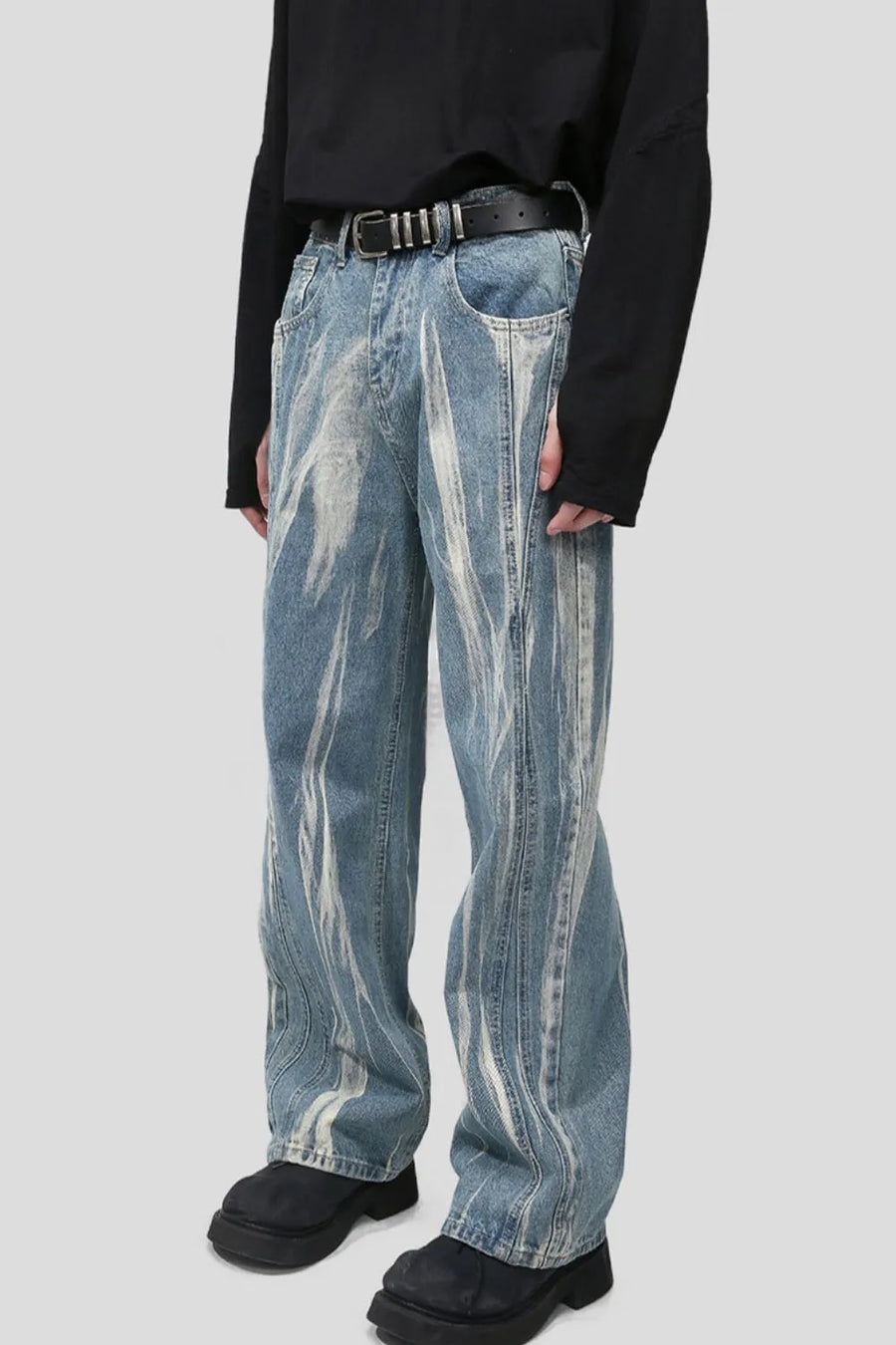 Bleached wash wide leg denim jeans with abstract white streaks and vertical seam details.