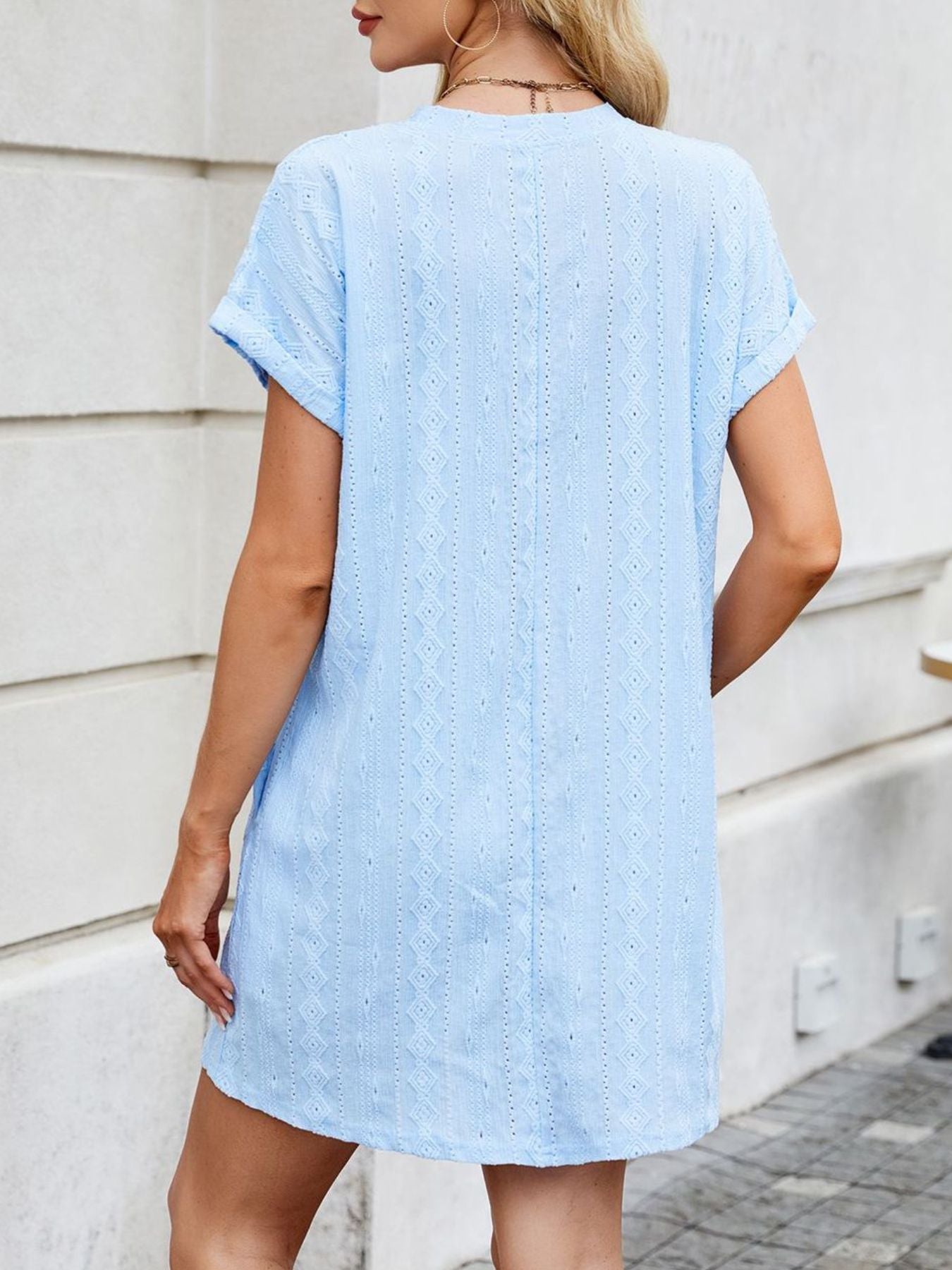 Light blue eyelet mini dress with diamond pattern and crew neck.