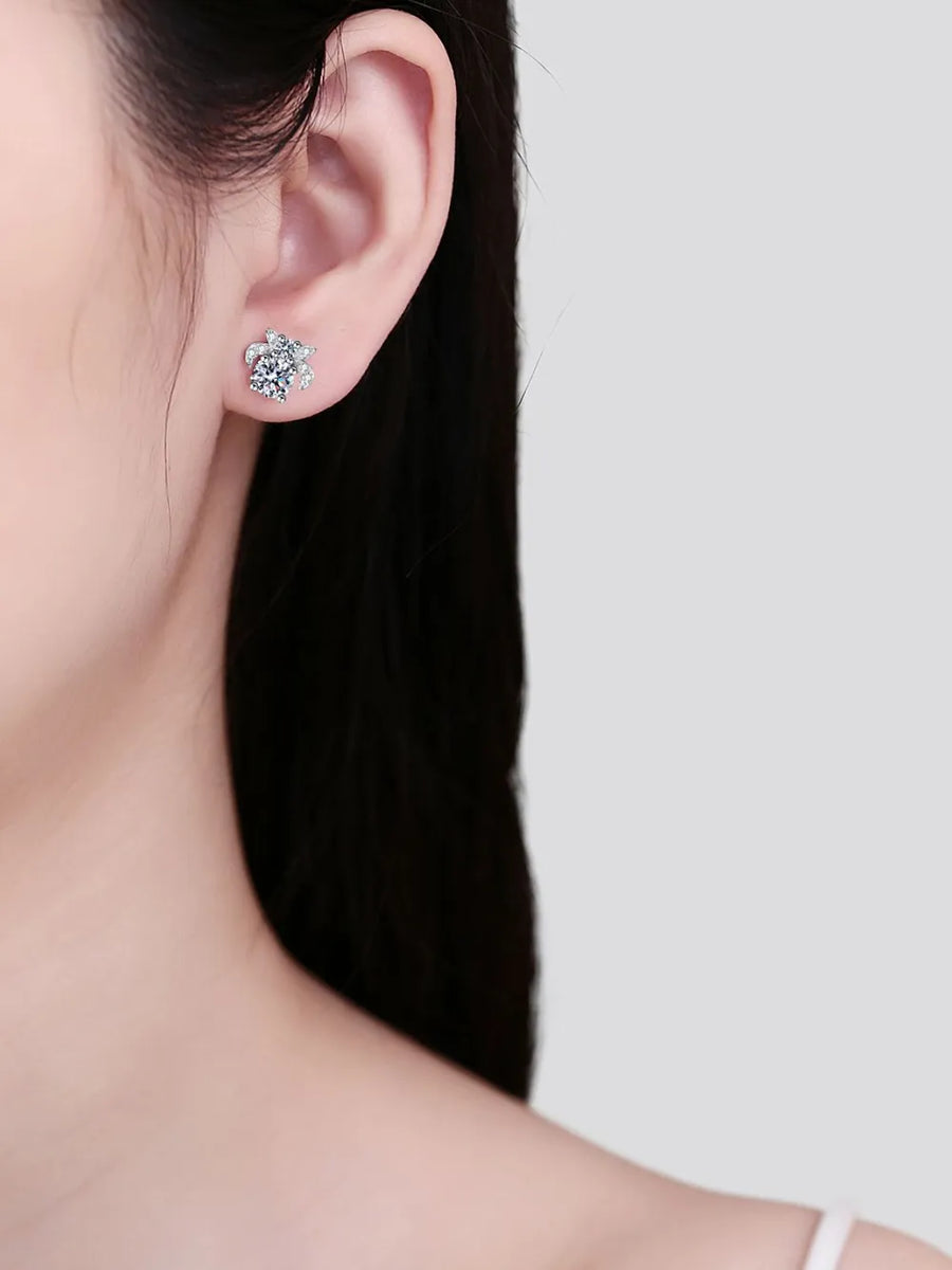 Silver moissanite floral cluster stud earrings with sparkling stones.