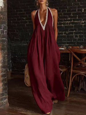 Maxi dress in burgundy with white lace trim, deep V-neck, and halter straps.