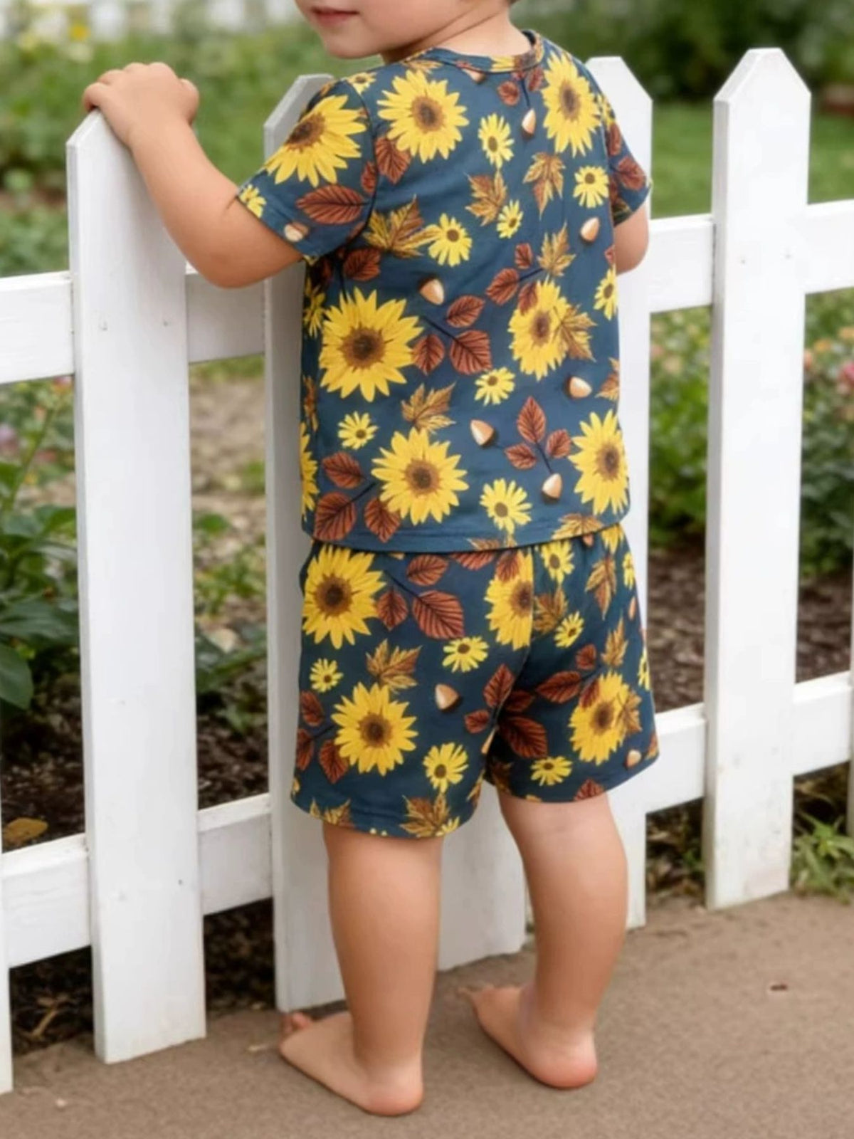 Toddler tee and shorts set with sunflower and leaf print in navy blue.