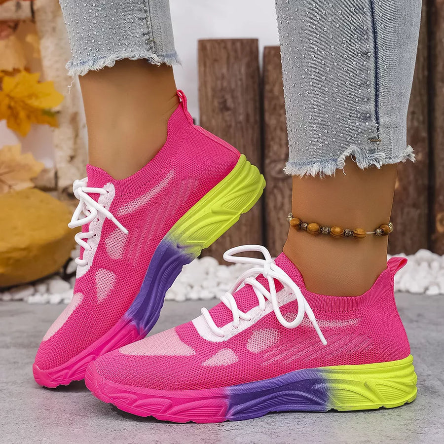 Breathable mesh lace-up sneakers in pink with a purple and yellow ombre sole.