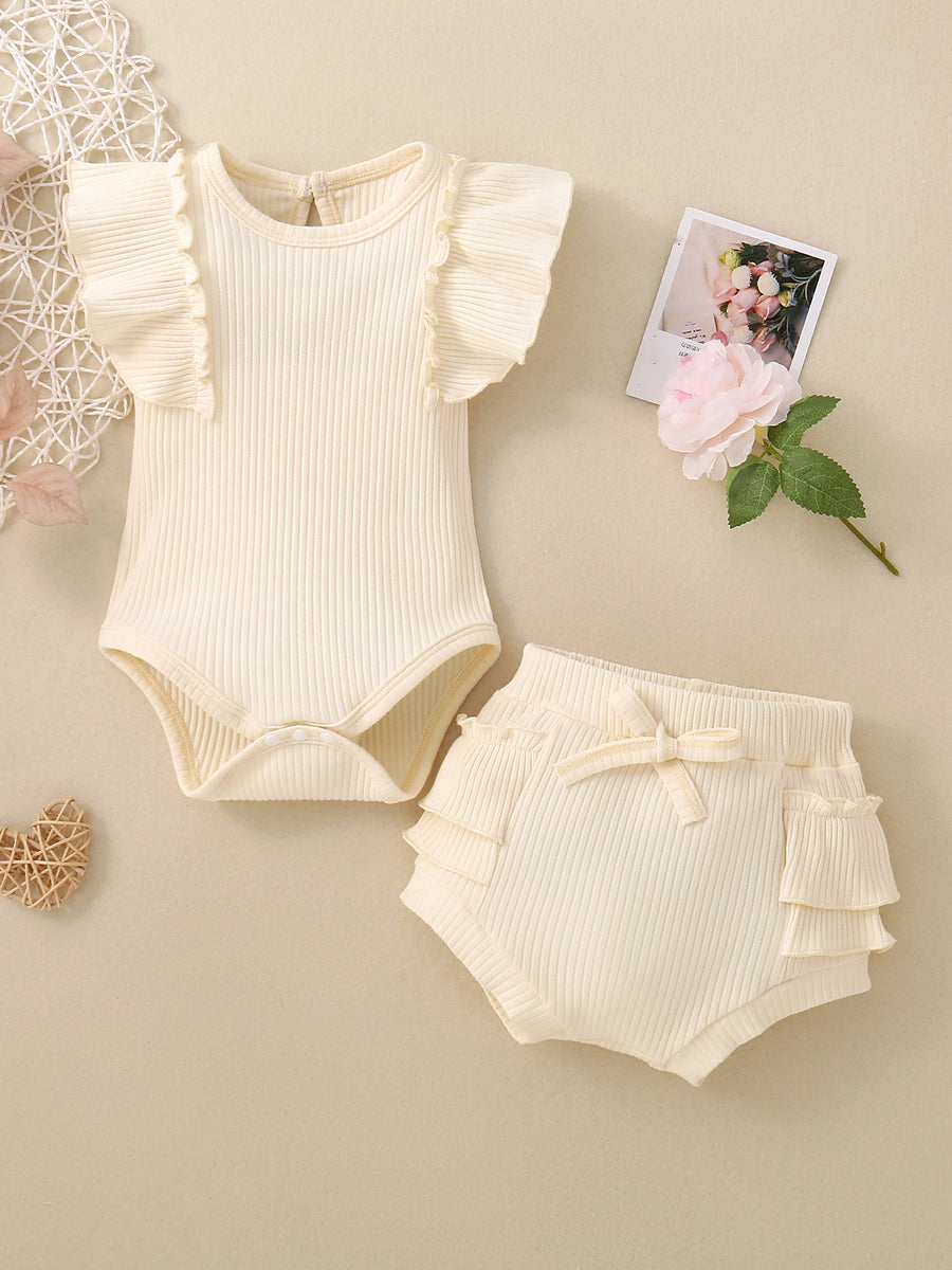 Cream ribbed baby set with ruffled flutter sleeves and tiered ruffle bloomers with bow detail.