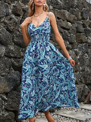 Maxi dress with blue paisley print, V-neck, smocked waist, and spaghetti straps.