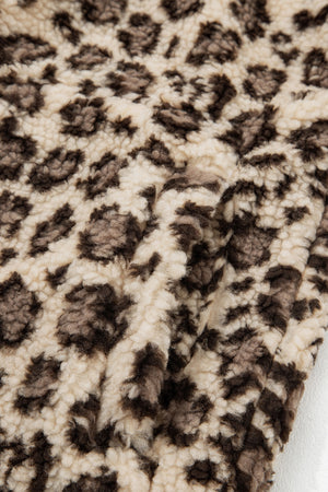 Shell: 100% polyester Lining:100% polyester Care instructions: Machine wash cold sweatshirt in dark brown with relaxed