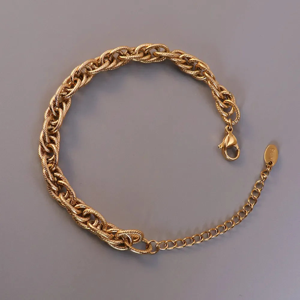 Gold textured rope chain bracelet with lobster clasp and extender chain.