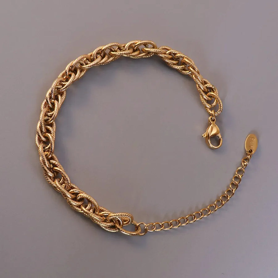 Gold textured rope chain bracelet with lobster clasp and extender chain.