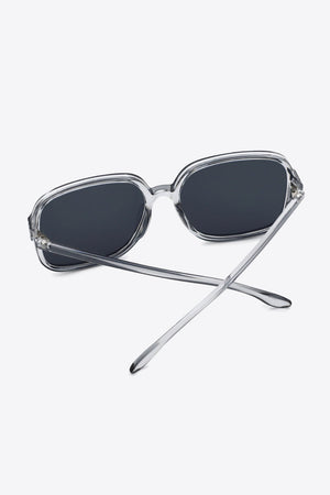 Retro square frame sunglasses with clear frames and dark lenses.