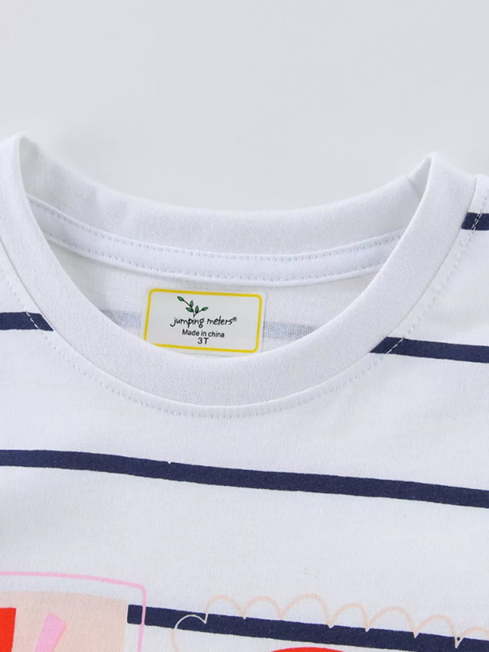White and navy striped baby t-shirt with rainbow graphic detail