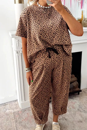 Two-piece set with animal print t-shirt and drawstring pants.