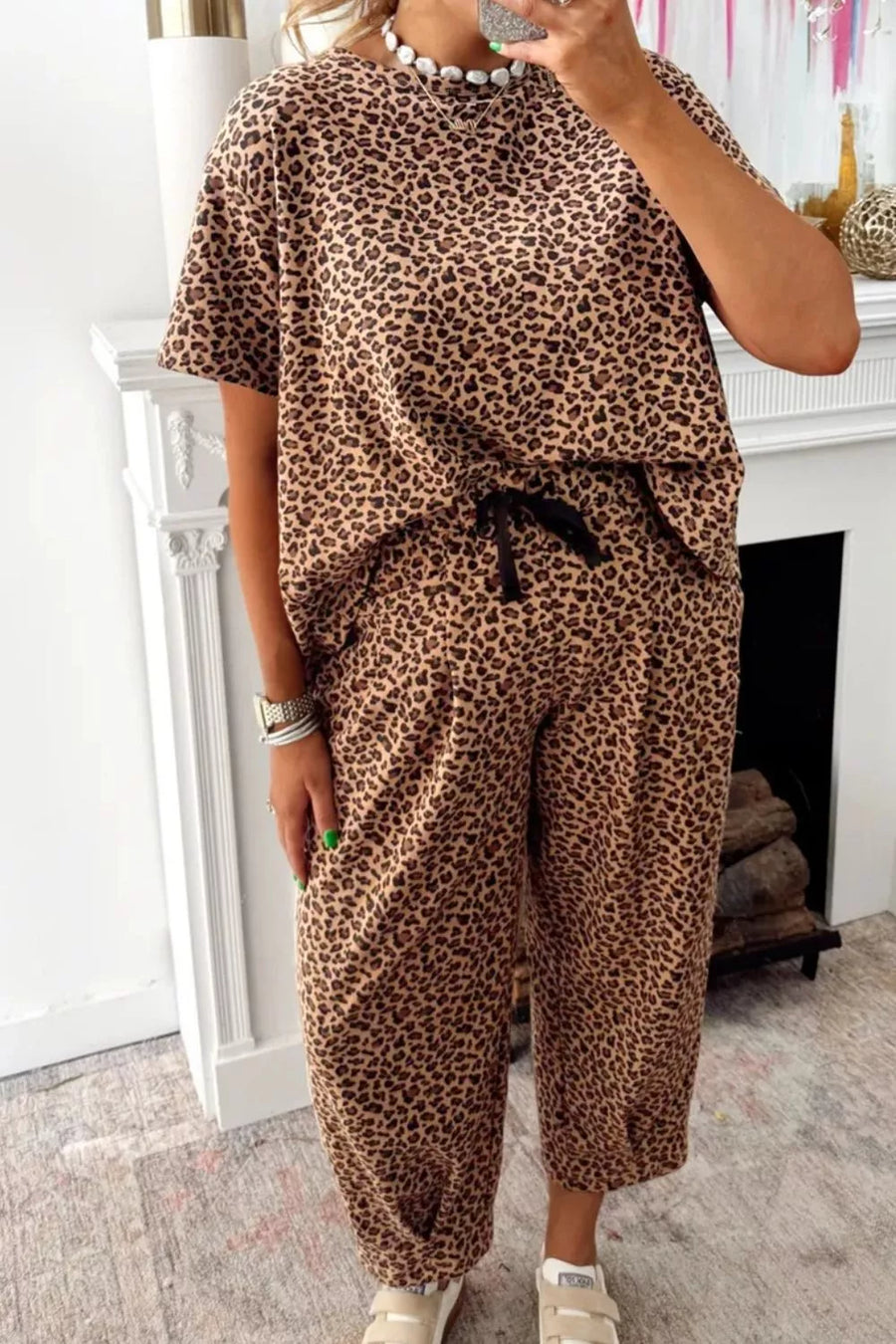 Two-piece set with animal print t-shirt and drawstring pants.