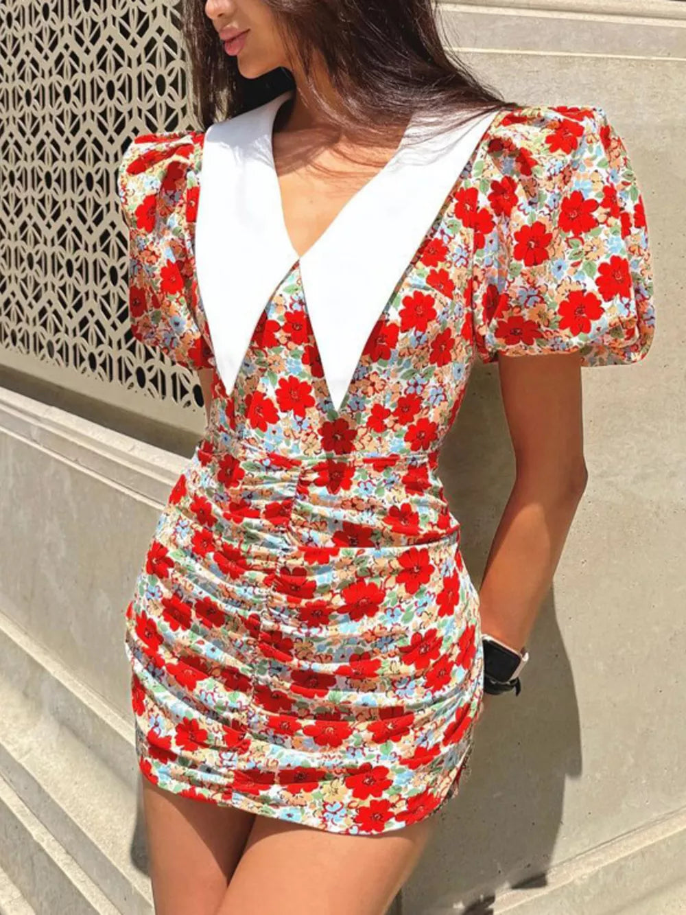 Floral print ruched mini dress with puff sleeves and a contrast white collar.