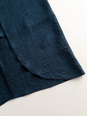 Dark Navy mock neck tank top with a textured fabric and curved hem detail.