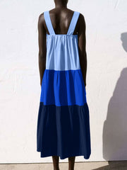 Three-tone wide strap tiered midi dress in light blue, royal blue, and navy.