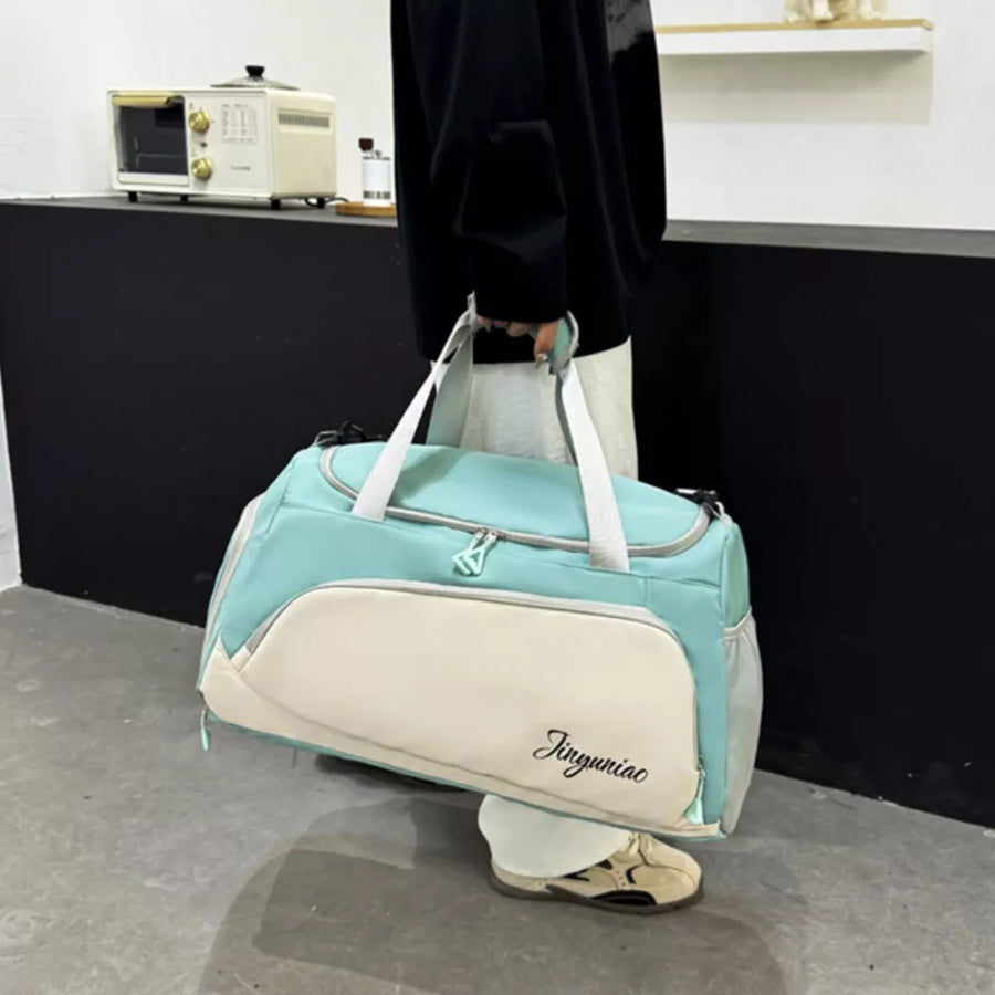 Light green and cream waterproof duffel bag with pockets and embroidered text.