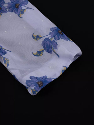 Sheer fabric blouse with blue floral print and white polka dots.
