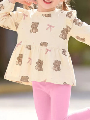 light pink peplum top featuring frill and bear print