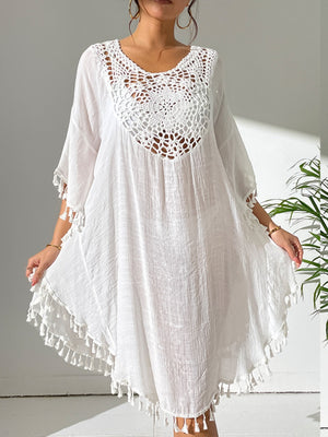 White crochet yoke tassel kaftan dress with a relaxed fit and boho style.