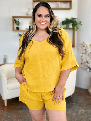 Gold textured cotton half sleeve v-neck top and drawstring shorts set.