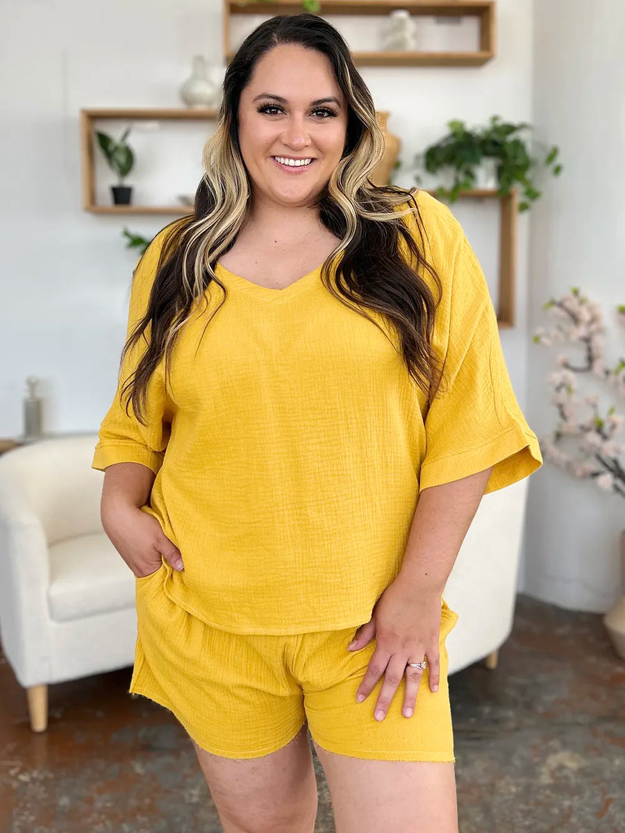 Gold textured cotton half sleeve v-neck top and drawstring shorts set.