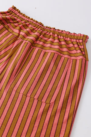 Wide leg drawstring pants in pink and brown stripes with functional pockets.