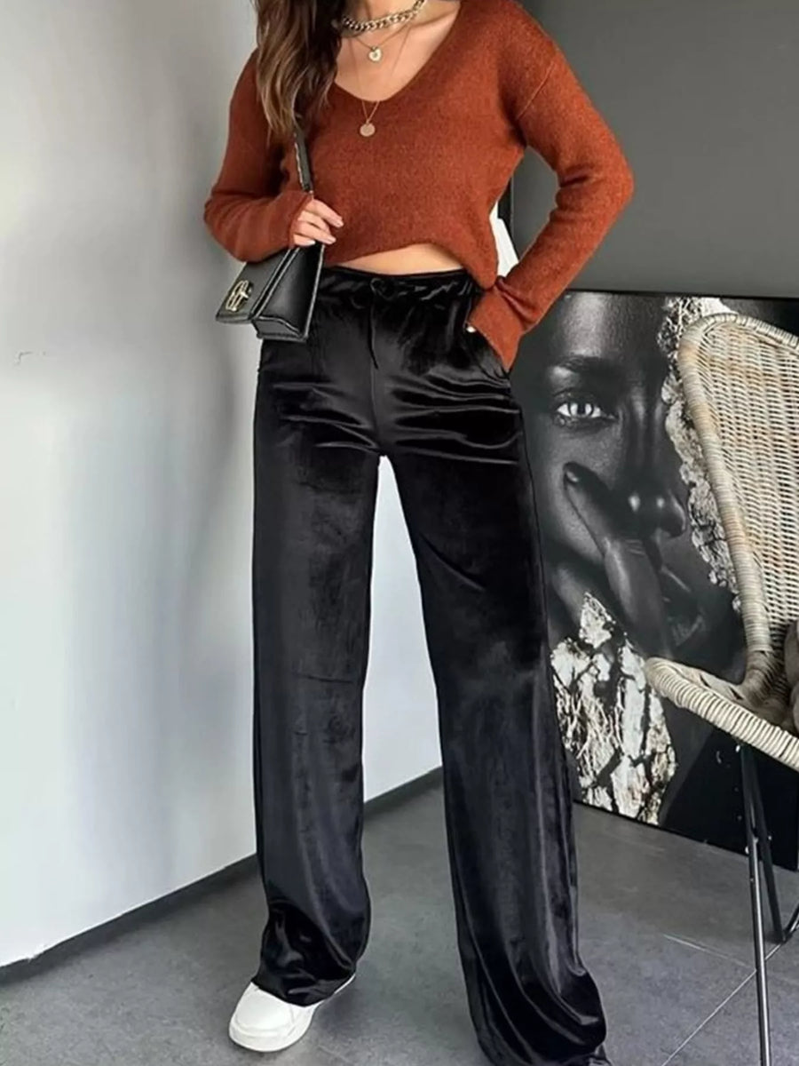 Black velvet tied wide-leg trousers with a comfortable fit.