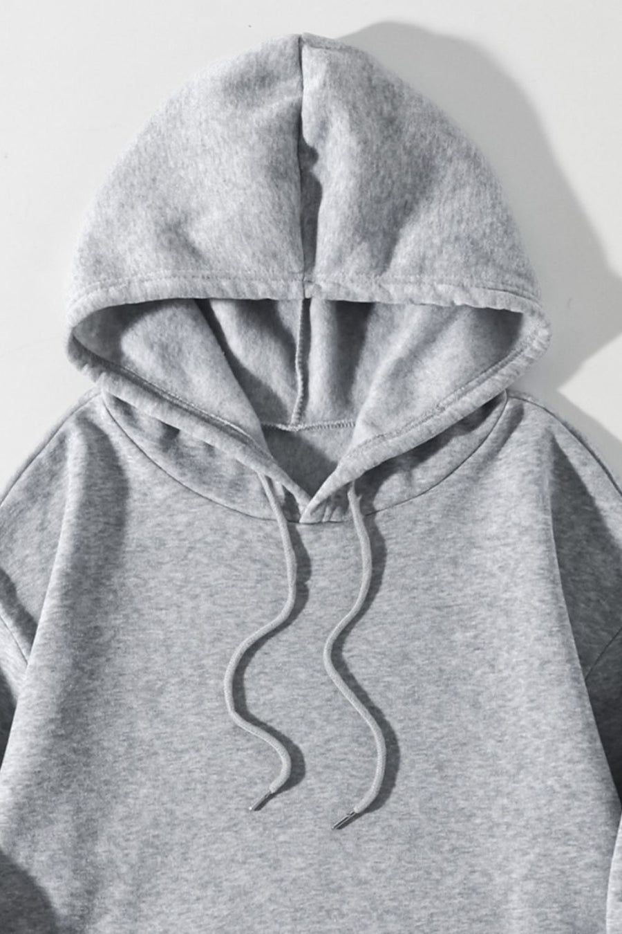 Gray oversized hoodie with drawstring and pouch pocket detail