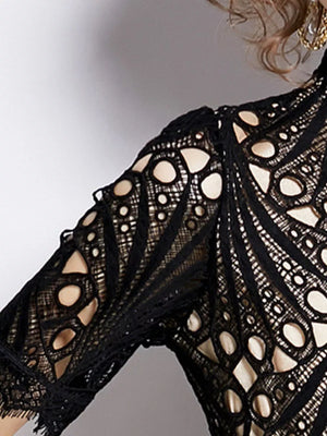 Elegant Black lace midi dress with delicate sleeves and intricate cutouts.