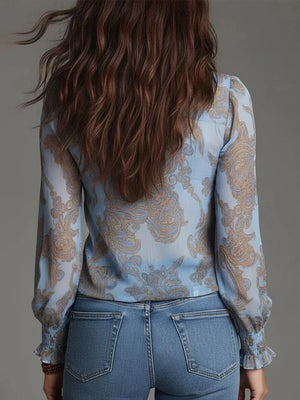 tan blouse with zip-front and paisley