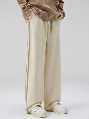Men's khaki sweatpants with side stripes and drawstring waist