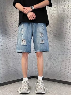 Men's light wash distressed denim wide leg shorts with ripped details.